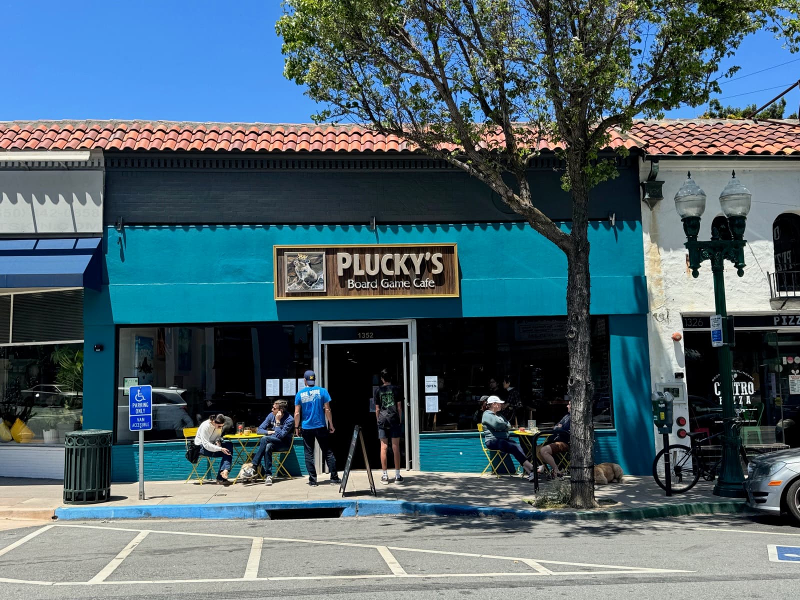 Plucky’s teal storefront on Broadway