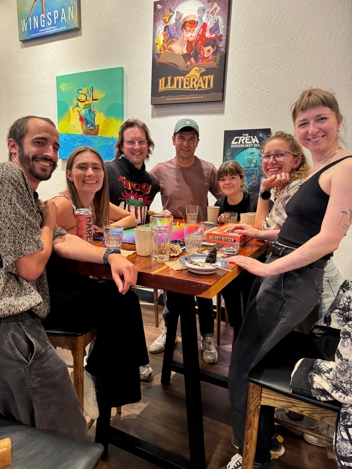 Seven friends around a game table