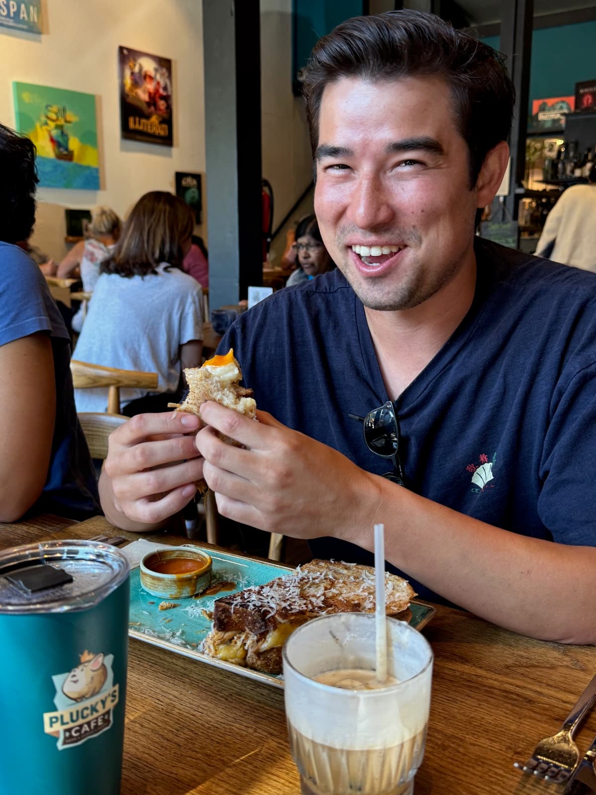A happy bite of a grilled sandwich